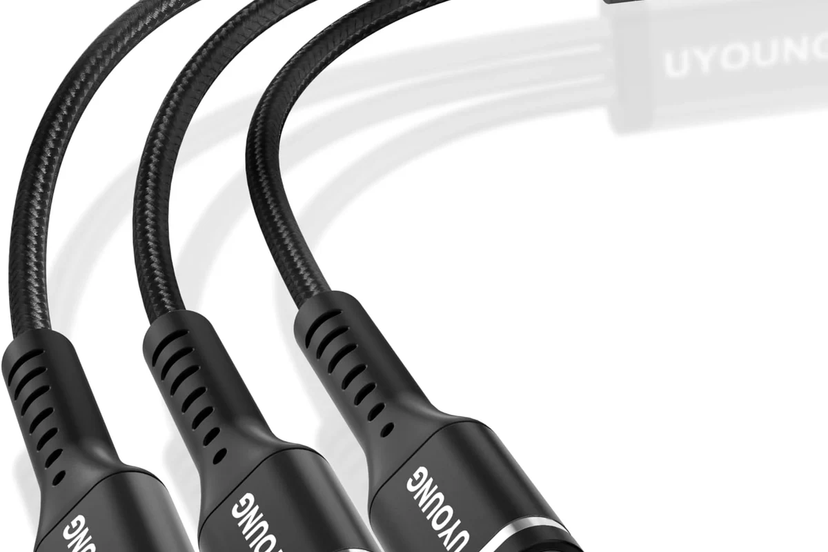USB-C cable connected to a charger and laptop showing charging power concept
